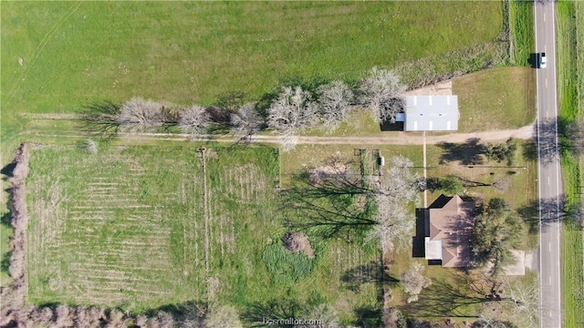 birds eye view of property with a rural view