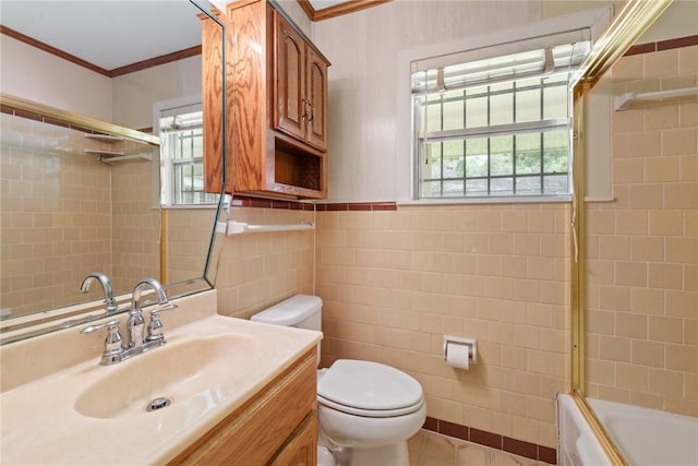 1704 N Pacific St, Conroe, TX 77301 - bathroom with tile walls, crown molding, healthy amount of natural light, toilet, and enclosed tub / shower combo