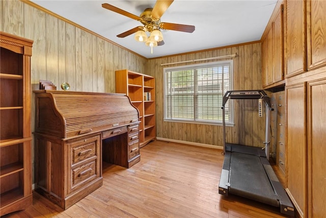 1704 N Pacific St, Conroe, TX 77301 - workout area featuring a ceiling fan, light wood-style flooring, baseboards, wooden walls, and ornamental molding
