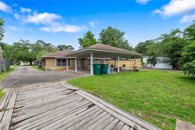 1704 N Pacific St, Conroe, TX 77301 - back of property featuring a carport