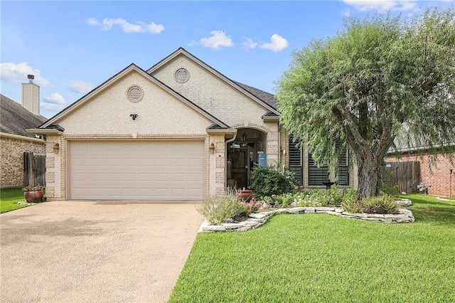 ranch-style house featuring a front yard and a garage