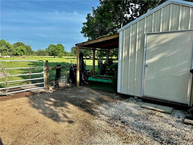 view of outdoor structure with a rural view