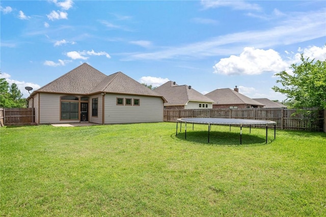4118 Cedar Creek Ct, College Station, TX 77845 - rear view of house featuring a trampoline and a patio area