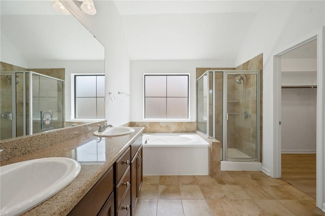 4118 Cedar Creek Ct, College Station, TX 77845 - full bathroom with lofted ceiling, a shower stall, a garden tub, double vanity, and a walk in closet