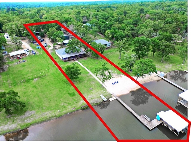 9462 Riley Green Rd, Franklin, TX 77856 - aerial view of property and surrounding area featuring property parcel outlined, a heavily wooded area, and a large body of water