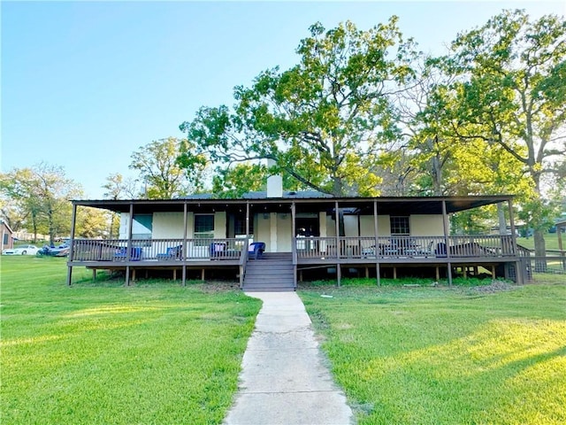 9462 Riley Green Rd, Franklin, TX 77856 - rear view of property with a yard and a chimney