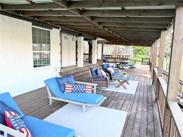 9462 Riley Green Rd, Franklin, TX 77856 - wooden deck with an outdoor hangout area
