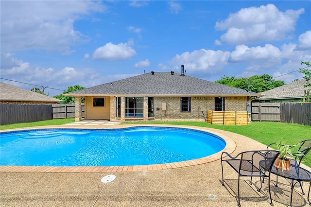 view of pool featuring a fenced in pool, a patio area, a fenced backyard, and a lawn