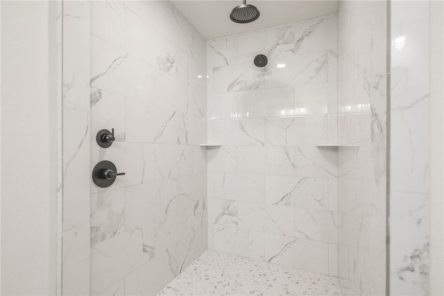 bathroom with tiled shower