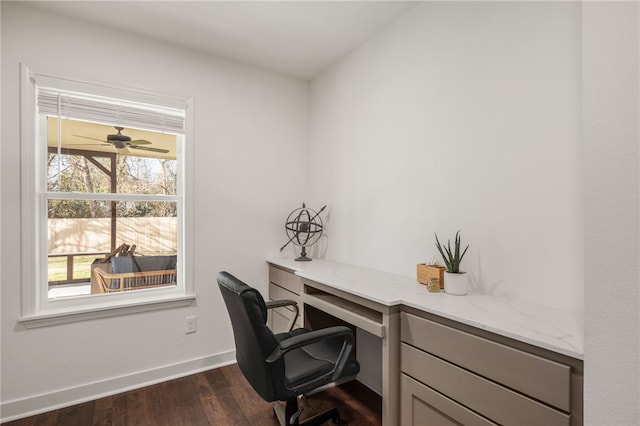 office space with dark hardwood / wood-style flooring and plenty of natural light