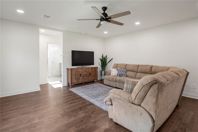 living room with ceiling fan and dark hardwood / wood-style floors