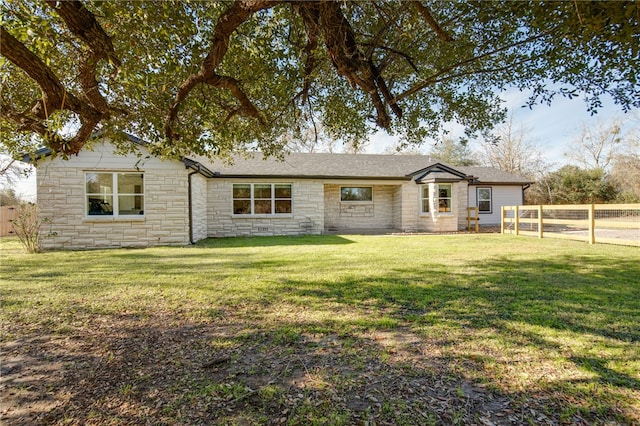 ranch-style house with a front lawn