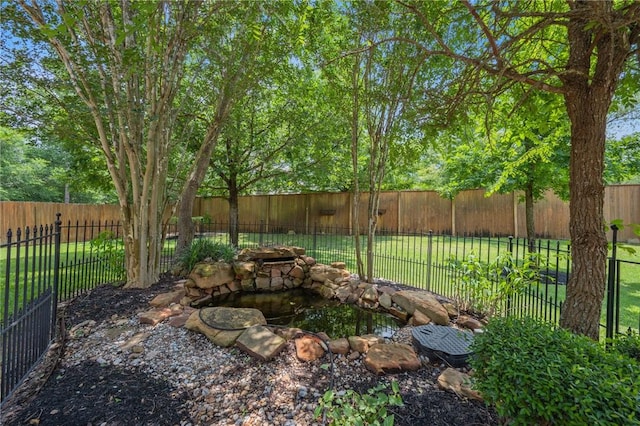 view of yard with a fenced backyard