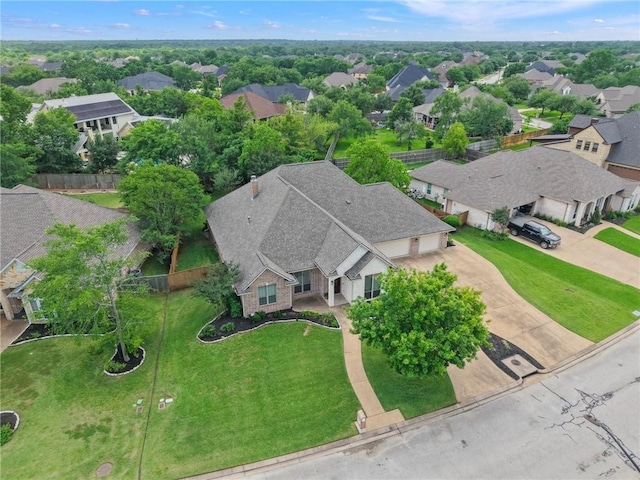 birds eye view of property with a residential view