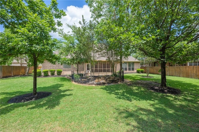 view of yard featuring a fenced backyard