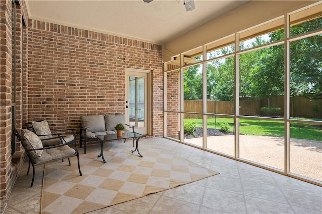 sunroom / solarium with ceiling fan