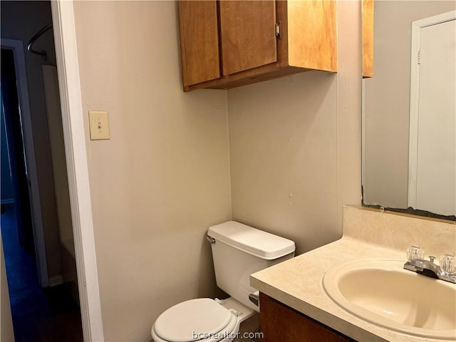 bathroom featuring vanity and toilet