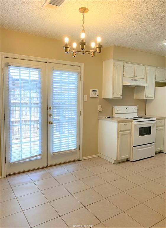 kitchen featuring white cabinetry, hanging light fixtures, white electric stove, a textured ceiling, and light tile patterned floors