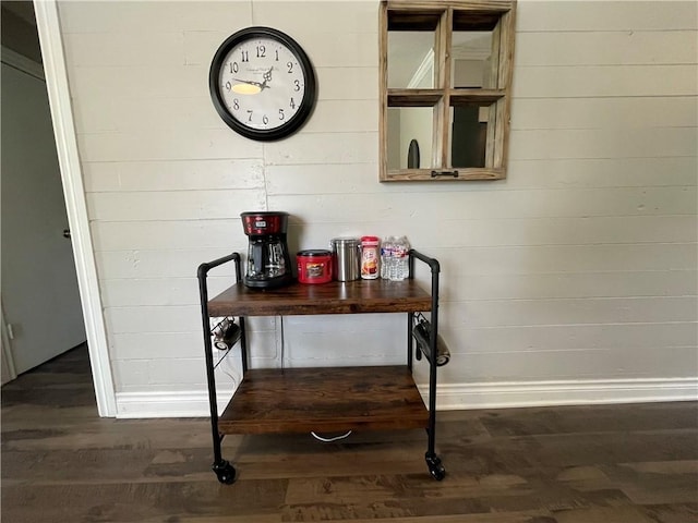 details featuring hardwood / wood-style flooring and wood walls