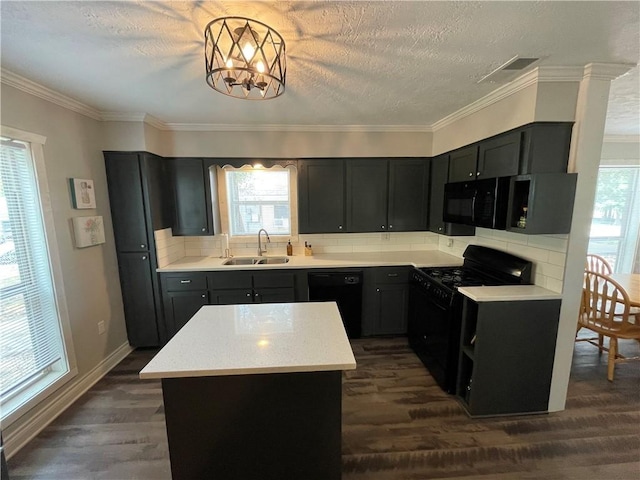 kitchen with a kitchen island, sink, decorative backsplash, black appliances, and dark wood-type flooring