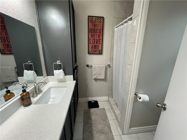 bathroom with tile patterned flooring, vanity, and a shower with curtain