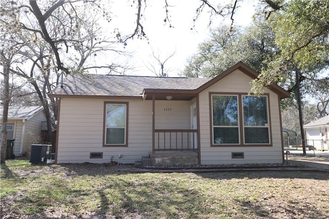 view of front of property featuring a front yard and central air condition unit