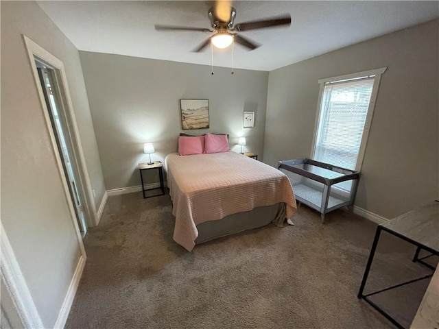 bedroom with ceiling fan and dark colored carpet