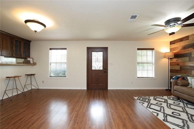 3000 Stevens Dr, Bryan, TX 77803 - living area with dark wood finished floors, baseboards, and ceiling fan