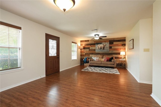 3000 Stevens Dr, Bryan, TX 77803 - living room with wood finished floors, a ceiling fan, and baseboards
