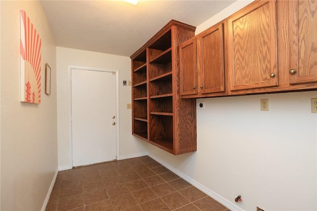 3000 Stevens Dr, Bryan, TX 77803 - mudroom with baseboards and dark tile patterned floors