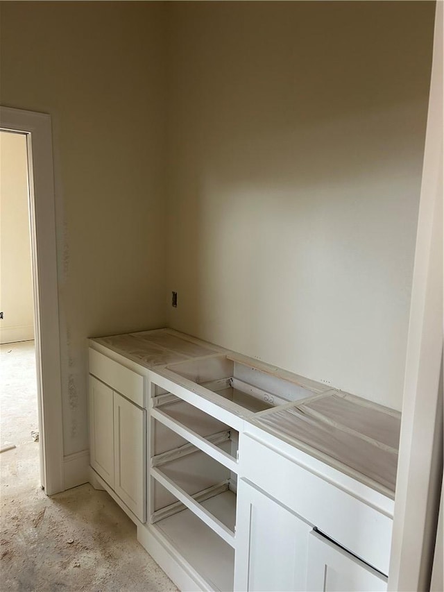 bar featuring white cabinets