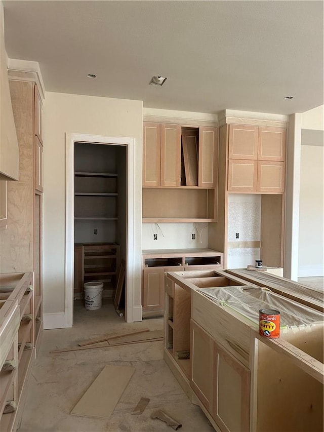 kitchen featuring light brown cabinetry