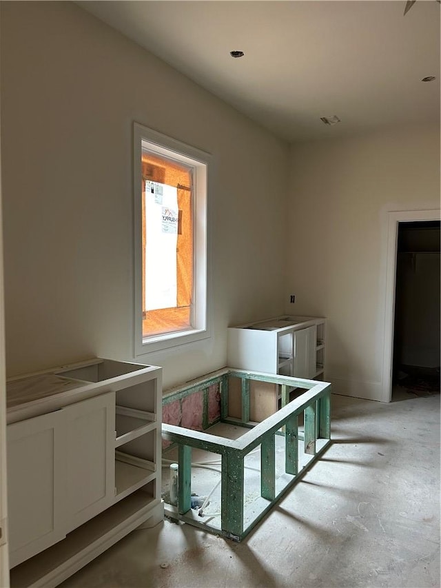 bathroom with concrete floors