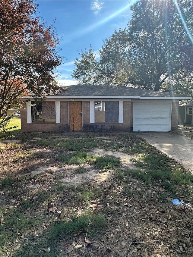 single story home with a garage