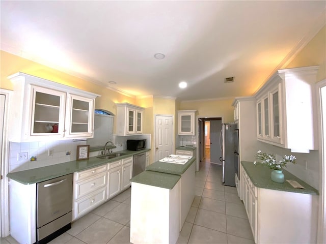 1608 Panther Ln, College Station, TX 77840 - kitchen with dishwasher, a kitchen island, a sink, black microwave, and ornamental molding
