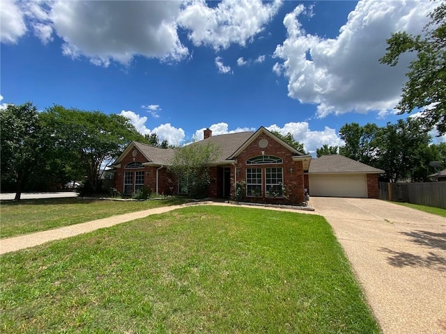 1608 Panther Ln, College Station, TX 77840 - ranch-style house with brick siding, an attached garage, driveway, and a chimney