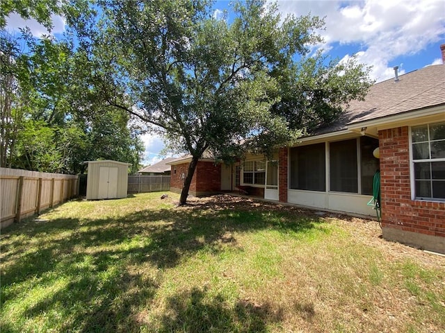 1608 Panther Ln, College Station, TX 77840 - view of yard with a storage unit, a sunroom, and an outdoor structure
