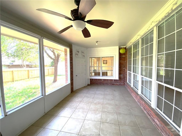 1608 Panther Ln, College Station, TX 77840 - unfurnished sunroom featuring healthy amount of natural light and a ceiling fan