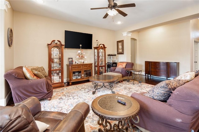 living room featuring ceiling fan and wood-type flooring