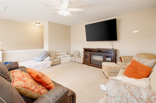 living room with ceiling fan and carpet floors