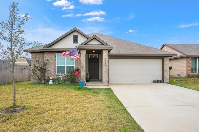 view of front of home featuring a garage and a front lawn