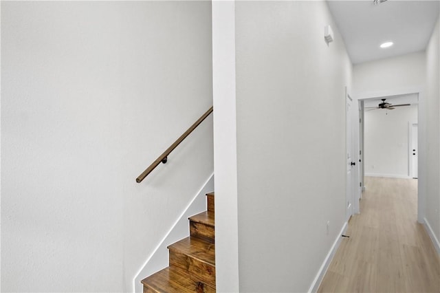 corridor with light hardwood / wood-style flooring