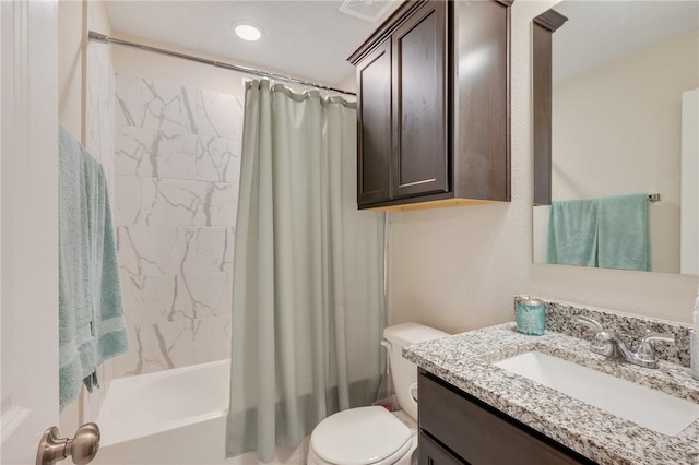 full bathroom featuring vanity, toilet, and shower / bath combo