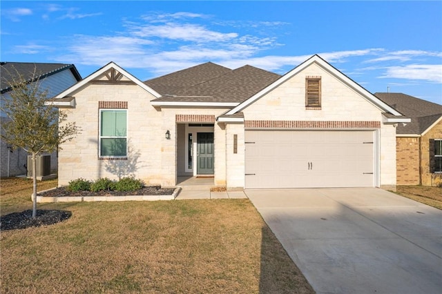 view of front of property featuring a garage and a front yard