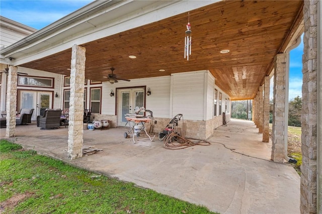 view of patio featuring ceiling fan and french doors