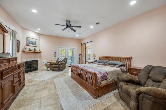 bedroom featuring ceiling fan and french doors