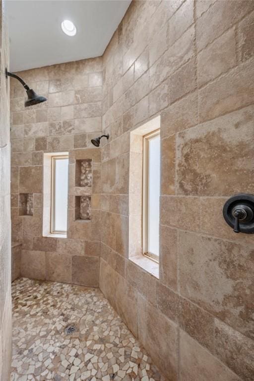 bathroom with tiled shower