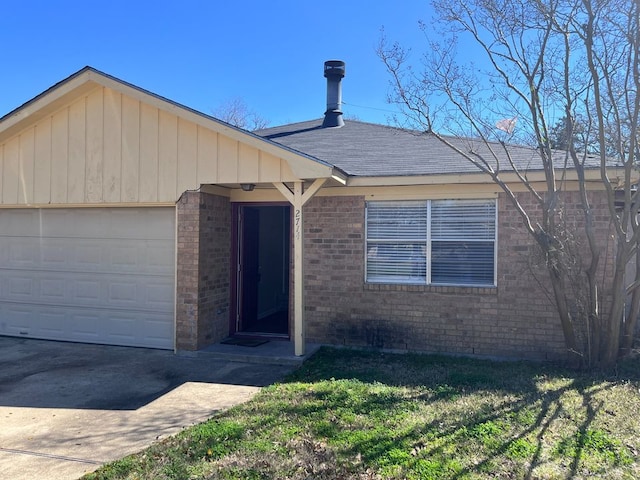 single story home with a garage and a front lawn