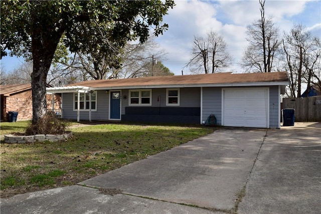 ranch-style house featuring a garage and a front lawn