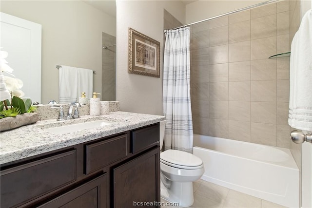 full bathroom featuring tile patterned flooring, vanity, toilet, and shower / bath combo with shower curtain